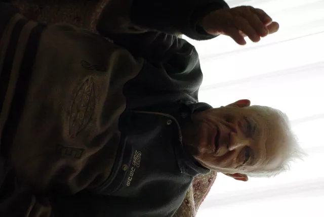 Avram Sadikario singing in his living room in Skopje