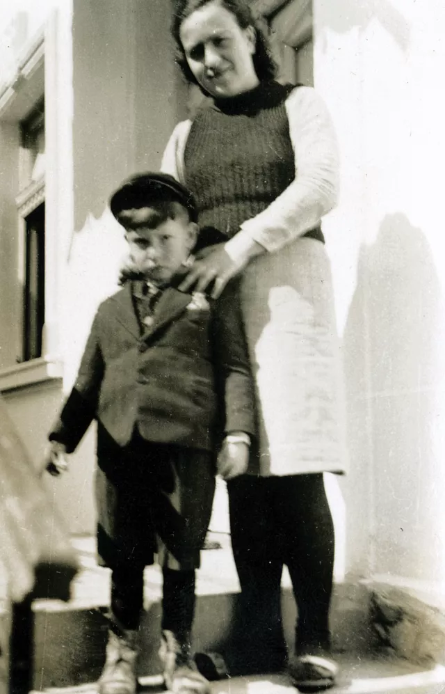 Nisim Navon's aunt Sarina Navon with her child Jakov in front of Nisim's grandparents' house