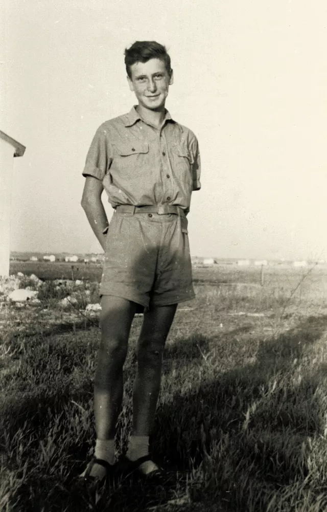 Jakov Navon, Nisim Navon's cousin, posing in a field