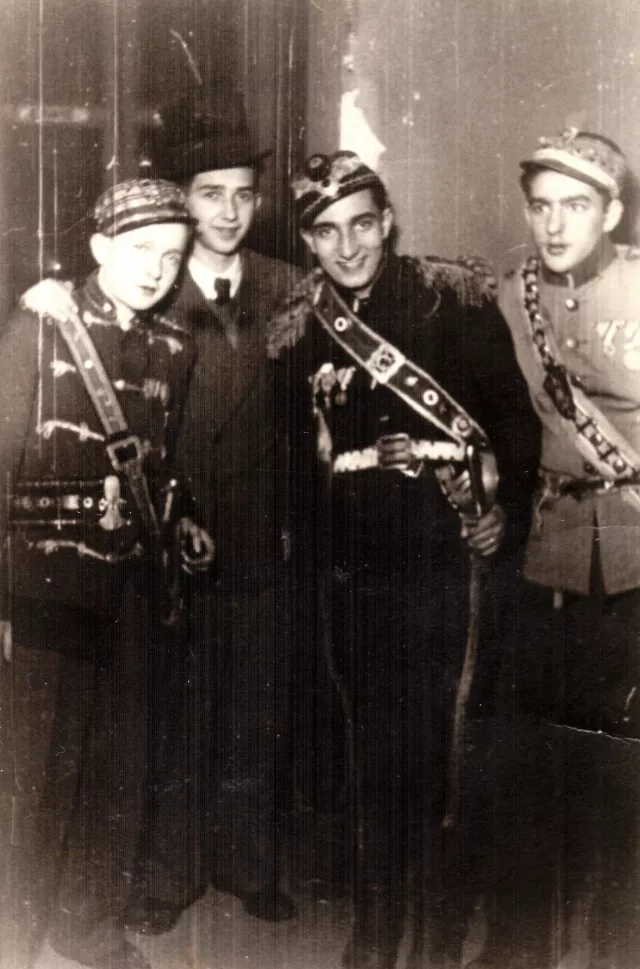 Rudich Manin with friends at a Purim ball