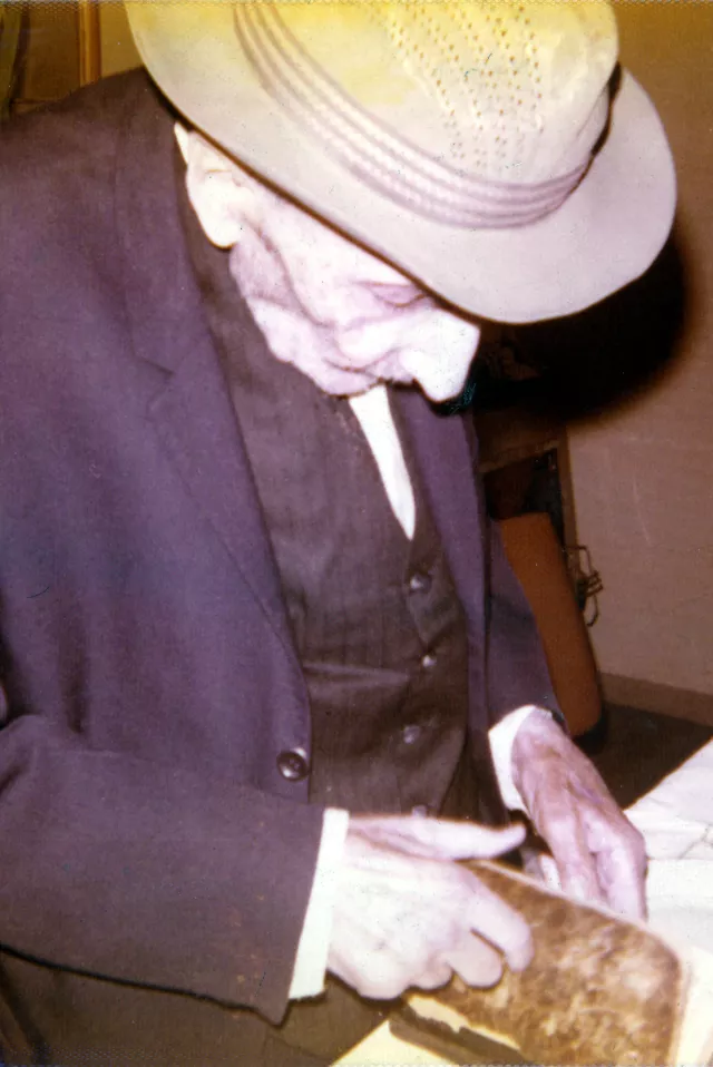 Ezra Bozo praying at the synagogue
