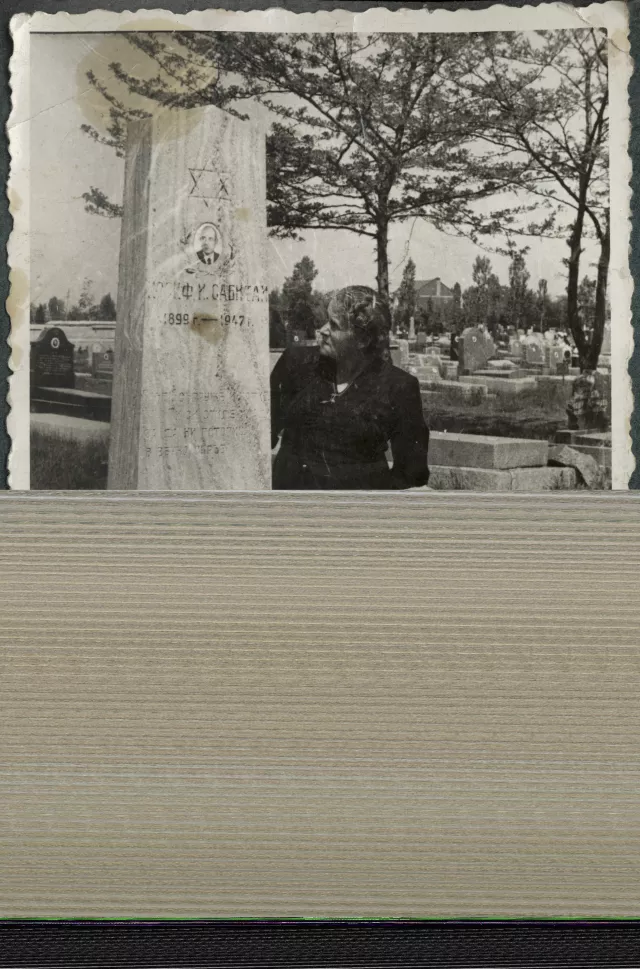 Sarina Sabitai at her husband's  tombstone